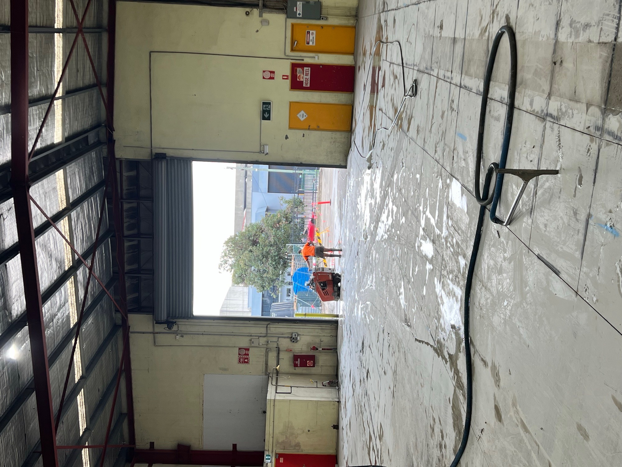 ALL CORE operator road sawing the existing warehouse concrete slab in Wetherill Park